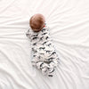 Milk Dino cotton sleepsuit