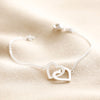 Interlocking Heart Charm Bracelet in Silver